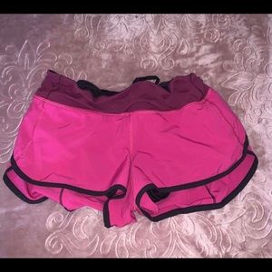 Size 6 pink lululemon shorts with black lining